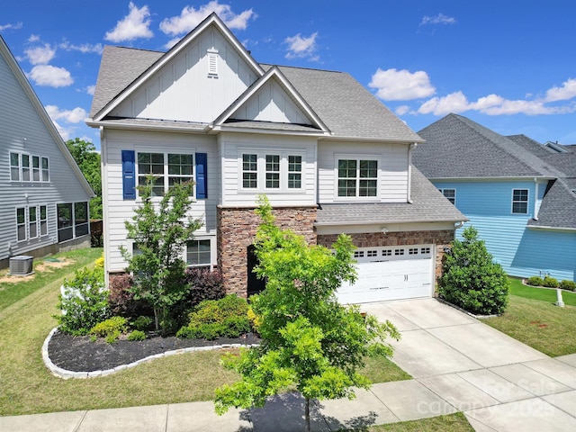 1001 Emory Ln, Fort Mill, SC 29708 - view of front of home featuring board and batten siding, driveway, a front yard, and central AC