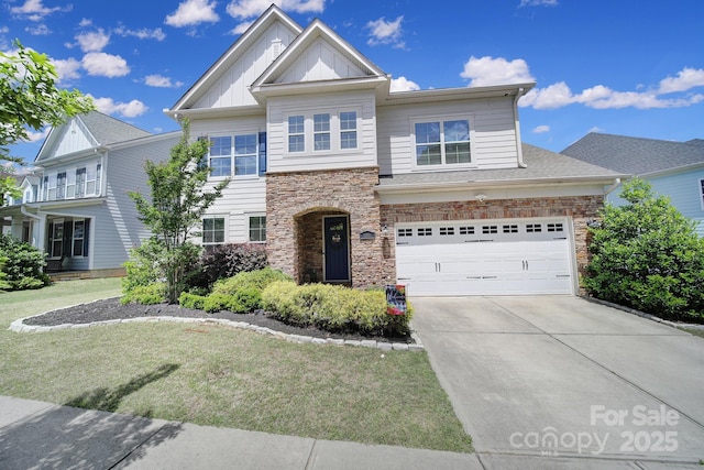 1001 Emory Ln, Fort Mill, SC 29708 - view of front facade with driveway, stone siding, a front yard, and board and batten siding