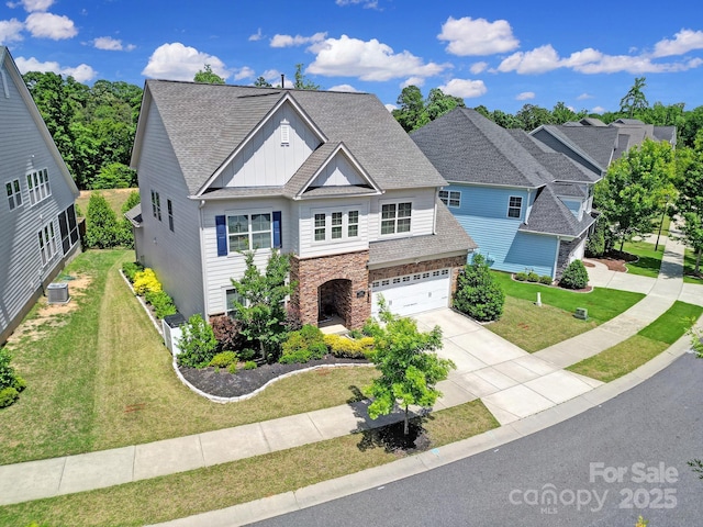 1001 Emory Ln, Fort Mill, SC 29708 - traditional home with concrete driveway, stone siding, board and batten siding, and a shingled roof