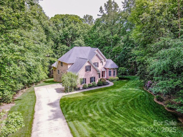 112 Eagle Chase Ln, Troutman, NC 28166 - view from above of property with a heavily wooded area