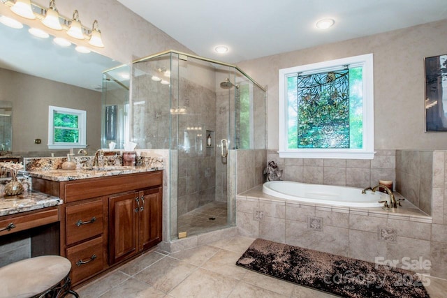 112 Eagle Chase Ln, Troutman, NC 28166 - full bathroom with tile patterned flooring, a bath, a shower stall, and vanity