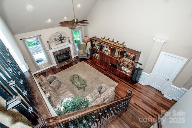 112 Eagle Chase Ln, Troutman, NC 28166 - living area with a fireplace, wood finished floors, a ceiling fan, and high vaulted ceiling