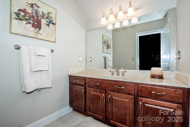 112 Eagle Chase Ln, Troutman, NC 28166 - bathroom featuring tile patterned floors, vanity, vaulted ceiling, and baseboards
