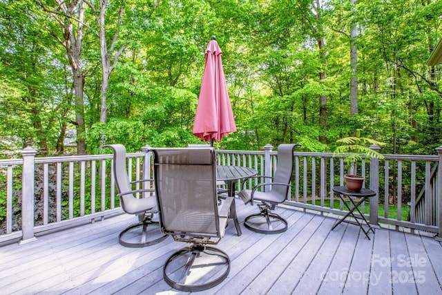 112 Eagle Chase Ln, Troutman, NC 28166 - wooden deck with outdoor dining area