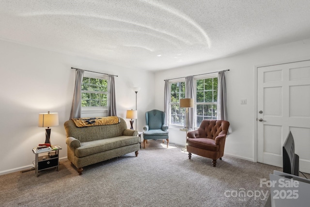 living room featuring carpet, a textured ceiling, and a wealth of natural light