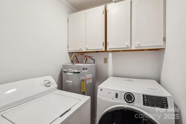 laundry area featuring washing machine and clothes dryer, electric water heater, ornamental molding, and cabinet space