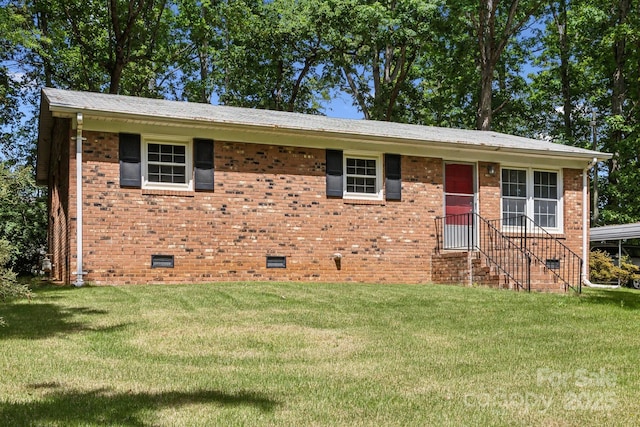 ranch-style home with brick siding, a front lawn, and crawl space