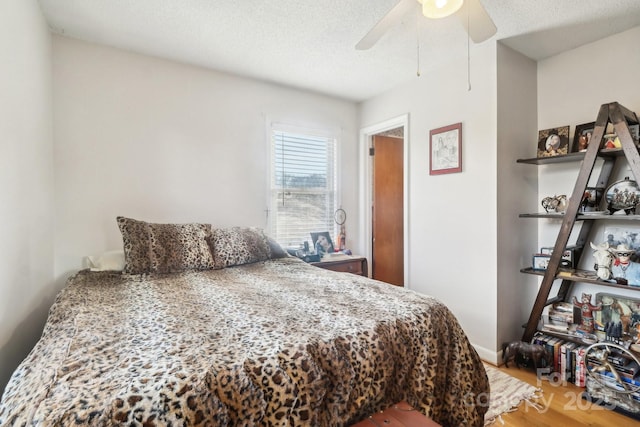 1177 Craigbrow Cir, Chester, SC 29706 - bedroom featuring a textured ceiling, a ceiling fan, and wood finished floors