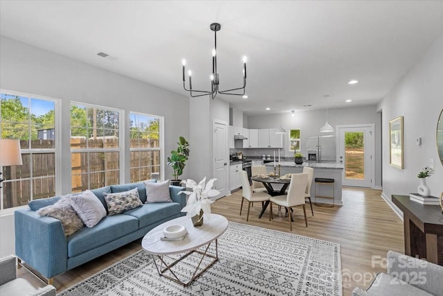 1914 White St Unit A & B, Gastonia, NC 28052 - living room with recessed lighting, a notable chandelier, light wood finished floors, and visible vents