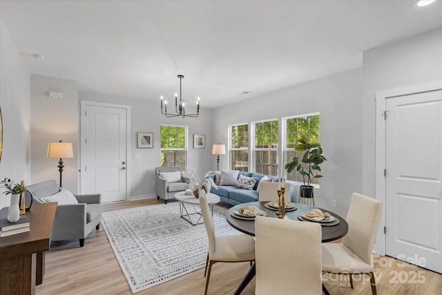 1914 White St Unit A & B, Gastonia, NC 28052 - dining room with baseboards, light wood-style floors, and an inviting chandelier