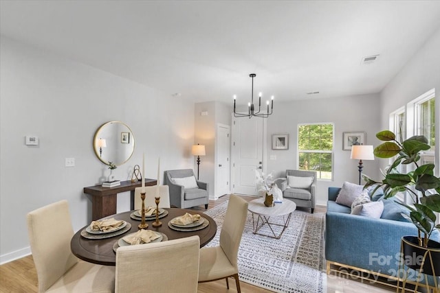 1914 White St Unit A & B, Gastonia, NC 28052 - living area featuring baseboards, a chandelier, visible vents, and light wood-style flooring