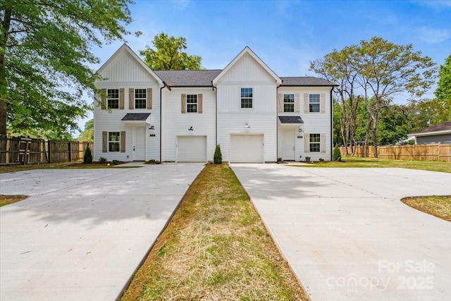 1914 White St Unit A & B, Gastonia, NC 28052 - view of front facade with driveway, board and batten siding, an attached garage, and fence