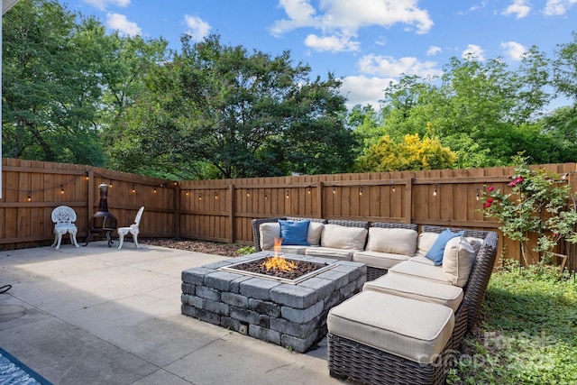 1001 Old Charlotte Rd, Concord, NC 28027 - view of patio with a fenced backyard and an outdoor living space with a fire pit