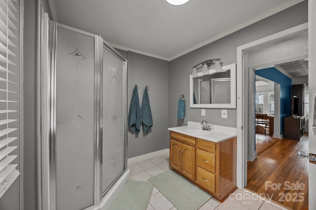 1001 Old Charlotte Rd, Concord, NC 28027 - full bathroom with a shower stall, ornamental molding, tile patterned floors, vanity, and baseboards
