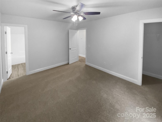 unfurnished bedroom featuring baseboards and carpet