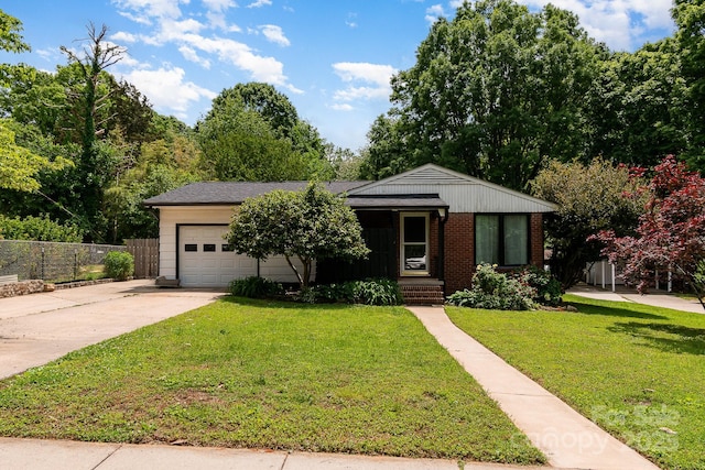 single story home featuring brick siding, fence, a front lawn, concrete driveway, and an attached garage