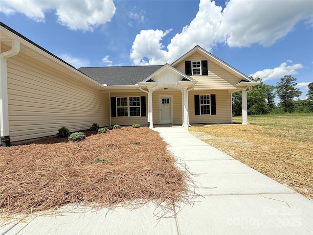 view of front of property featuring covered porch