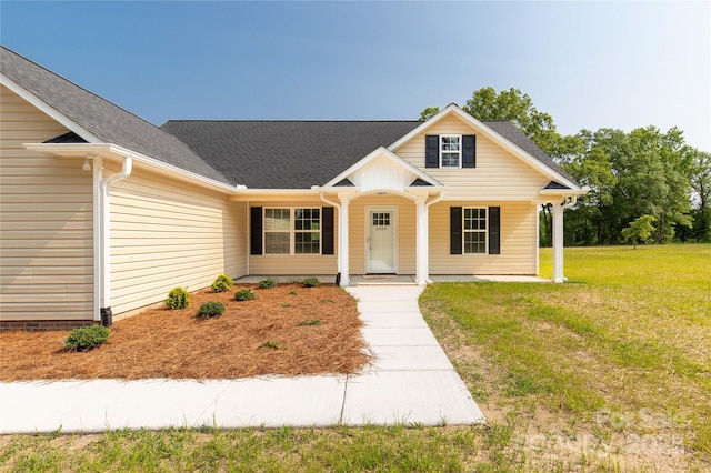 3650 Sentry Rd, Lancaster, SC 29720 - view of front of house with a front lawn, covered porch, and roof with shingles
