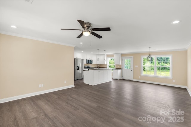 3650 Sentry Rd, Lancaster, SC 29720 - unfurnished living room featuring crown molding, ceiling fan, dark wood-style flooring, and recessed lighting