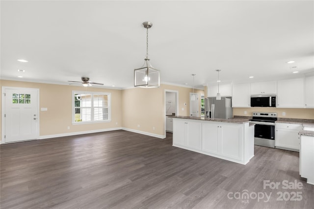 3650 Sentry Rd, Lancaster, SC 29720 - kitchen with appliances with stainless steel finishes, white cabinets, a ceiling fan, dark wood finished floors, and ornamental molding