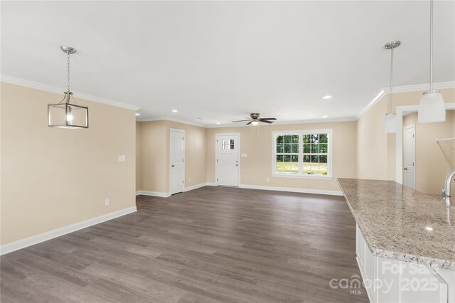3650 Sentry Rd, Lancaster, SC 29720 - unfurnished living room with ceiling fan, dark wood-type flooring, recessed lighting, and ornamental molding