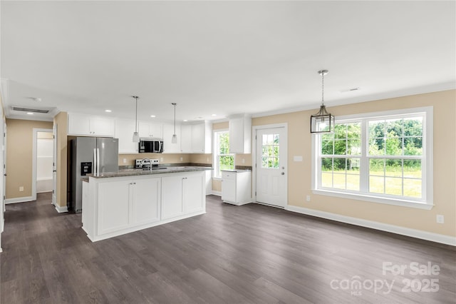 3650 Sentry Rd, Lancaster, SC 29720 - kitchen featuring appliances with stainless steel finishes, white cabinetry, recessed lighting, dark wood-type flooring, and a center island