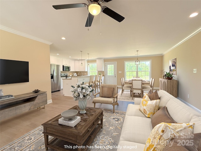 3650 Sentry Rd, Lancaster, SC 29720 - living area with light wood finished floors, crown molding, recessed lighting, and a ceiling fan