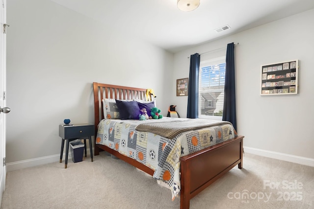 carpeted bedroom featuring baseboards