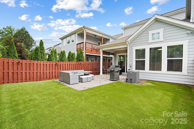 back of property with a patio, outdoor lounge area, and a balcony