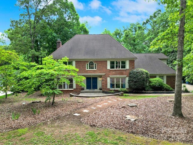 8524 Quarters Ln, Mint Hill, NC 28227 - colonial inspired home with a chimney and brick siding