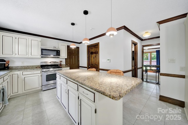 8524 Quarters Ln, Mint Hill, NC 28227 - kitchen featuring stainless steel appliances, light tile patterned floors, ornamental molding, a kitchen island, and baseboards