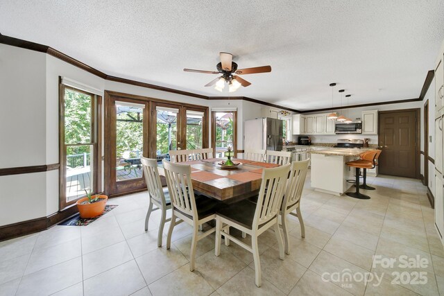 8524 Quarters Ln, Mint Hill, NC 28227 - dining area featuring crown molding, plenty of natural light, ceiling fan, a textured ceiling, and light tile patterned floors