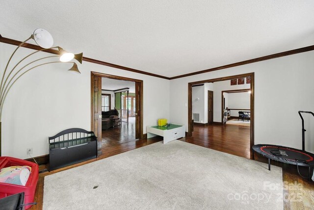 8524 Quarters Ln, Mint Hill, NC 28227 - sitting room featuring ornamental molding, carpet, wood finished floors, and baseboards
