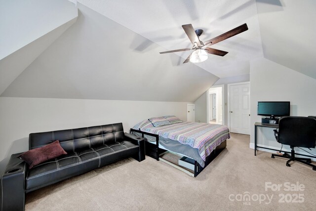 8524 Quarters Ln, Mint Hill, NC 28227 - carpeted bedroom with vaulted ceiling, ceiling fan, a desk, and baseboards