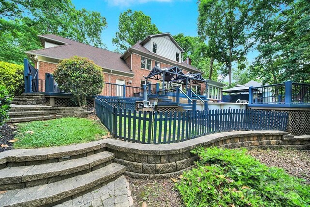 8524 Quarters Ln, Mint Hill, NC 28227 - back of property featuring a deck, brick siding, and stairway
