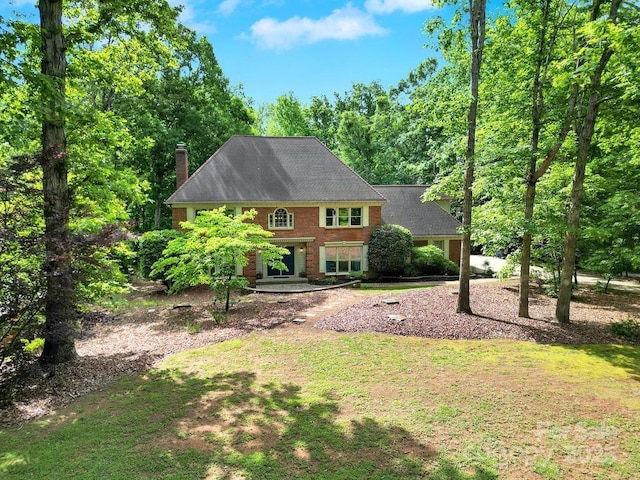 8524 Quarters Ln, Mint Hill, NC 28227 - view of front of house with a chimney and brick siding
