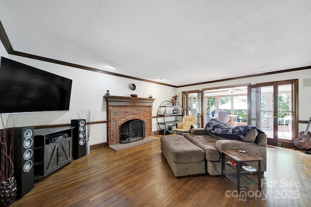 8524 Quarters Ln, Mint Hill, NC 28227 - living area with ornamental molding, wood finished floors, a textured ceiling, french doors, and a brick fireplace