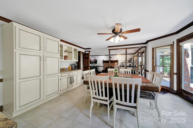 8524 Quarters Ln, Mint Hill, NC 28227 - dining area with ornamental molding, light tile patterned floors, a textured ceiling, and ceiling fan