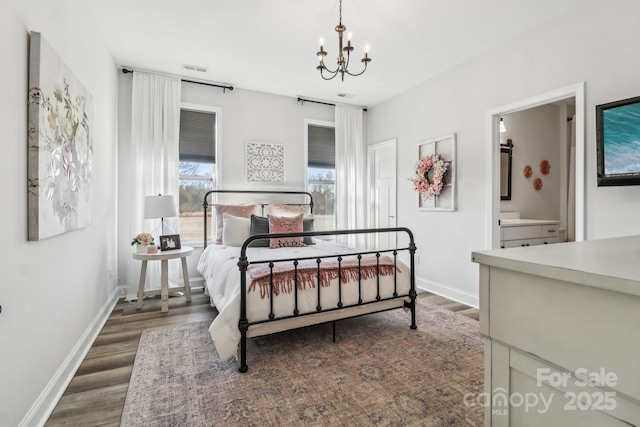 bedroom featuring baseboards, dark wood finished floors, a chandelier, and visible vents