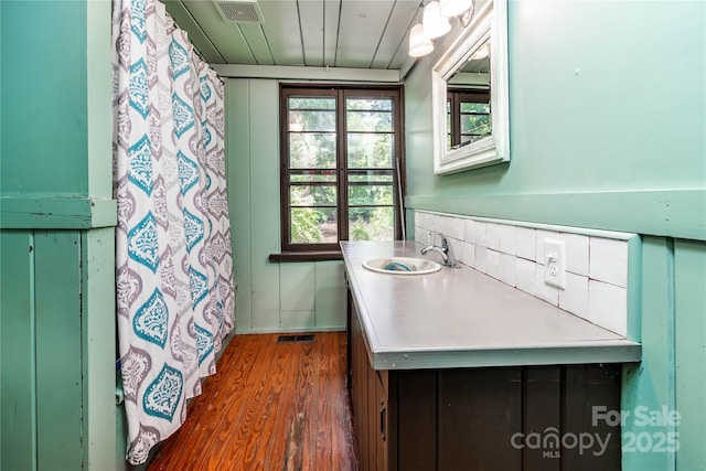 bathroom featuring wood finished floors and vanity