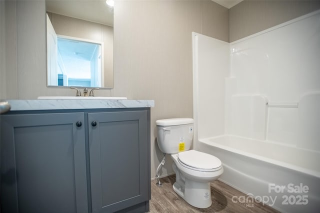 full bath with vanity, toilet, and wood finished floors