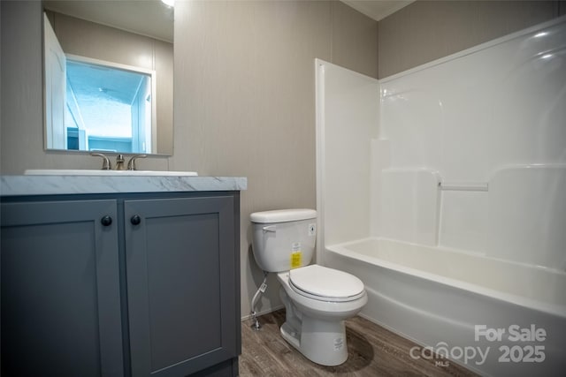 full bathroom featuring vanity, toilet, and wood finished floors