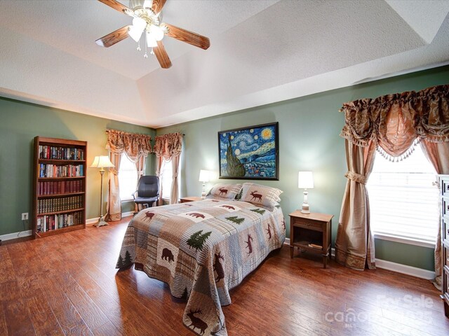 2547 Bill Thompson Rd, Lancaster, SC 29720 - bedroom featuring a raised ceiling, wood finished floors, baseboards, and ceiling fan