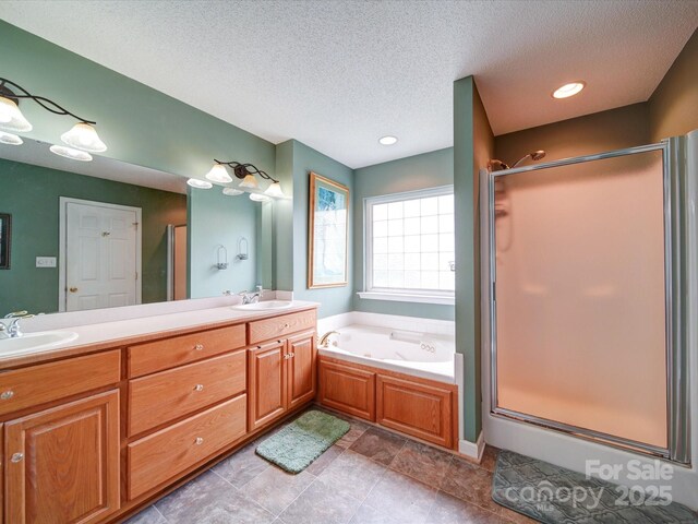 2547 Bill Thompson Rd, Lancaster, SC 29720 - bathroom with a stall shower, a whirlpool tub, double vanity, a textured ceiling, and recessed lighting