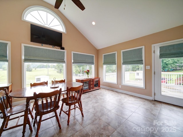 2547 Bill Thompson Rd, Lancaster, SC 29720 - tiled dining area with high vaulted ceiling, ceiling fan, and baseboards