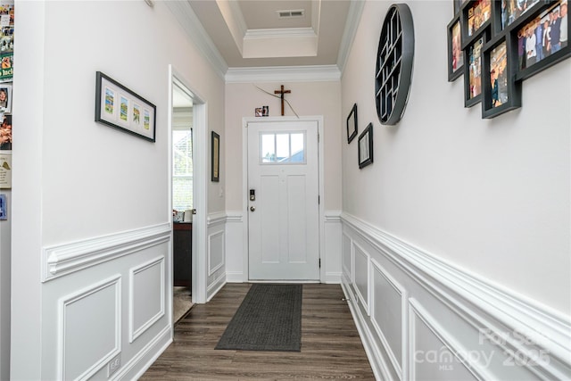 70 Cameo Dr, Flat Rock, NC 28731 - doorway to outside featuring crown molding, a decorative wall, dark wood-style floors, and a wainscoted wall