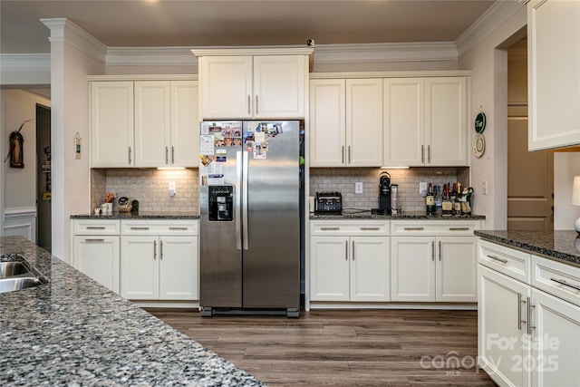 70 Cameo Dr, Flat Rock, NC 28731 - kitchen with stainless steel fridge, dark wood finished floors, dark stone counters, crown molding, and tasteful backsplash