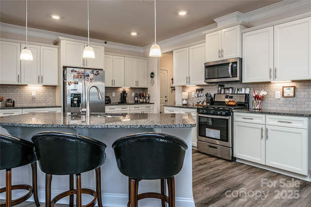 70 Cameo Dr, Flat Rock, NC 28731 - kitchen featuring stainless steel appliances, a breakfast bar area, backsplash, ornamental molding, and recessed lighting