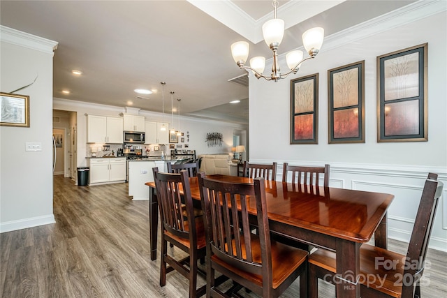 70 Cameo Dr, Flat Rock, NC 28731 - dining area with wood finished floors, ornamental molding, a chandelier, and recessed lighting