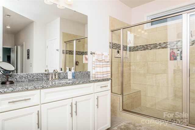 70 Cameo Dr, Flat Rock, NC 28731 - bathroom featuring a stall shower and vanity